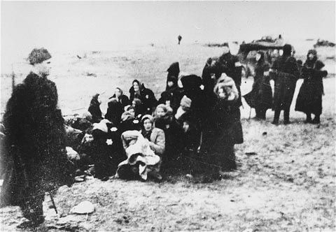 Members of the 21st Latvian Police Battalion assemble a group of Jewish women for execution